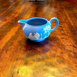 Wedgwood creamer light blue / lavender with cream accents.